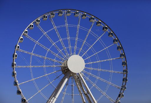 Ferris wheel on a background blue sky in HONG KONG