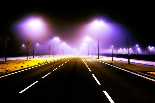 Road and city lights. Foggy cityscape and lampost