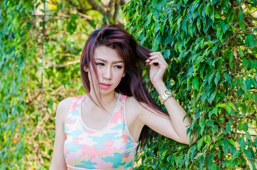 Portrait of charming woman in sportswear, model is a asian girl.