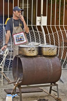 SAO PAULO, BRAZIL - MAY 17, 2015: An unidentified Man make  food at street fair market in Sao Paulo. 