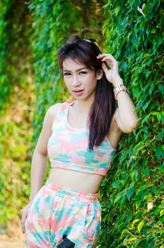 Portrait of charming woman in sportswear, model is a asian girl.