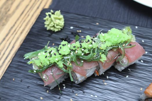 set of tuna sushi on ceramic plate