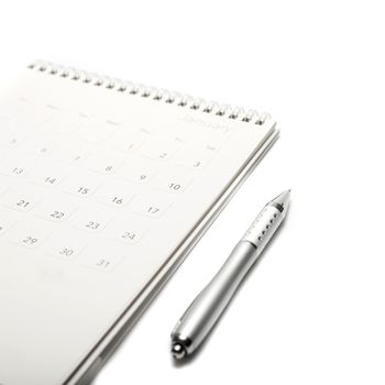 calendar and pen isolated on white background