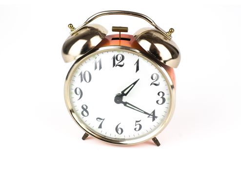 Close up of an alarm clock on a white background