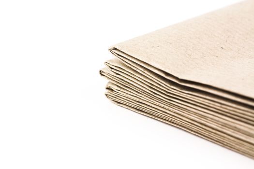 Stack of folded up brown parcel paper