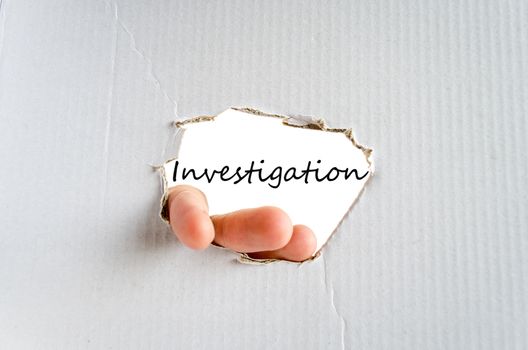 Hand and text on the cardboard background Investigation Concept