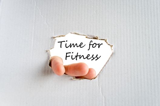 Hand and text on the cardboard background Time for fitness concept