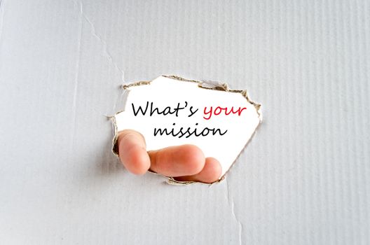 Hand and text on the cardboard background What's your mission concept
