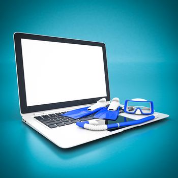 flippers, mask and snorkel and white laptop on a blue background