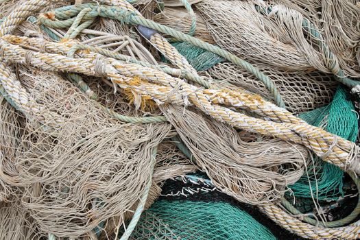 Abstract background with a pile of old sea rope fishing nets