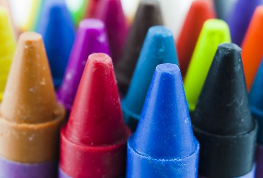 Close up of different coloured crayons