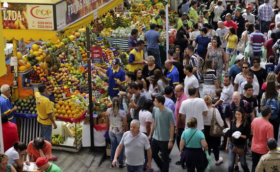 SAO PAULO/BRAZIL - MAY 9: An unidentified vendor at a fruit stand in Central Market of Sao Paulo on May 09, 2015. This landmark is a destination for tourists and locals.