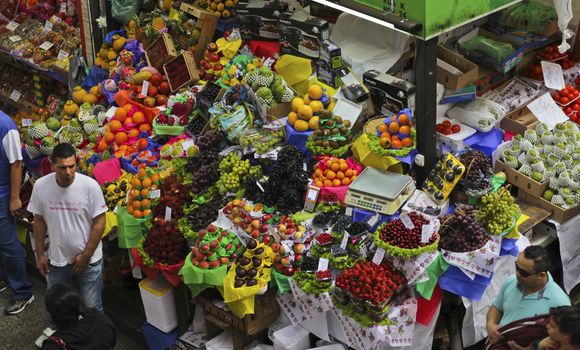 SAO PAULO/BRAZIL - MAY 9: An unidentified men a fruit stand in Central Market of Sao Paulo on May 09, 2015. This landmark is a destination for tourists and locals.