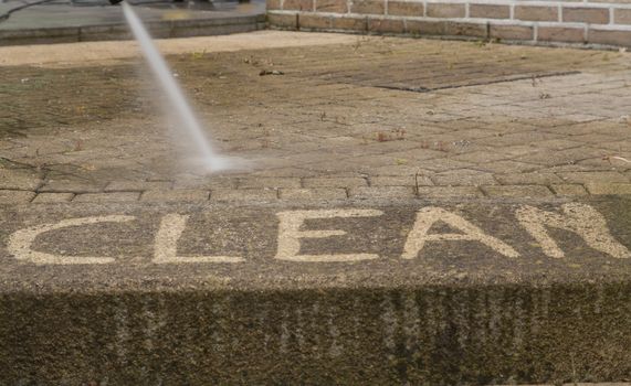 Outdoor floor cleaning with high pressure water jet