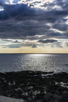 Sky with clouds before a rainstorm over the black sea at Giardini-Naxos, Sicily, Italy