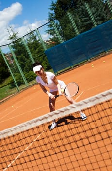 Woman playing tennis, summertime saturated theme