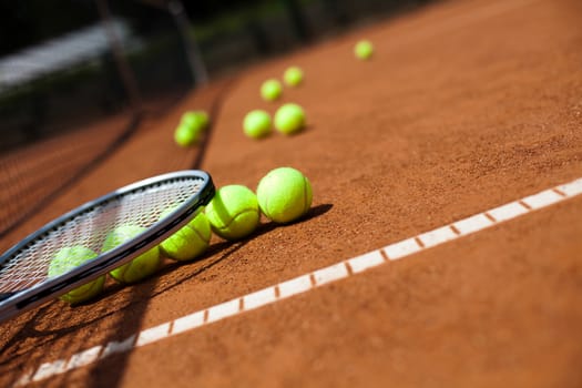 Tennis racket and balls, court