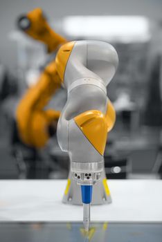 High technology robotic arm closeup photo in factory
