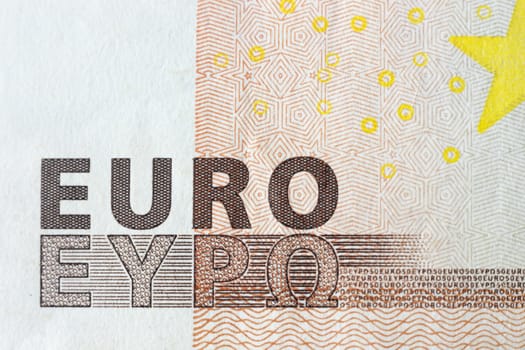 Euro banknotes, detailed text on a new fifty euro banknotes. Macro euro concept