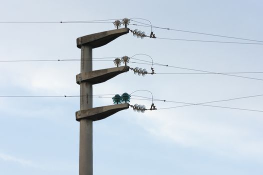 Electrical wire on pole. chaotic wire with nest on pole and blue sky background