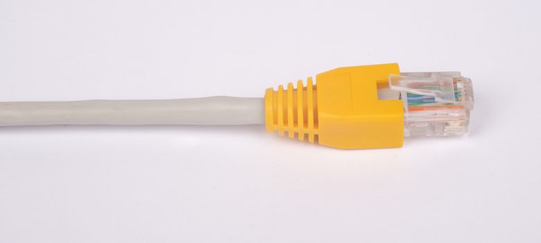 Yellow computer cable on isolated white background