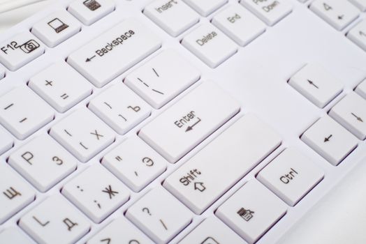 Computer keyboard on isolated white background, close up view