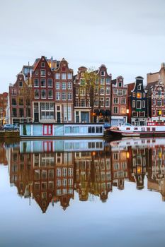 Night city view of Amsterdam, the Netherlands with Amstel river