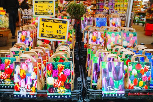 AMSTERDAM - APRIL 17: Boxes with bulbs at the Floating flower market  on April 17, 2015 in Amsterdam, Netherlands. It’s usually billed as the “world’s only floating flower market”.
