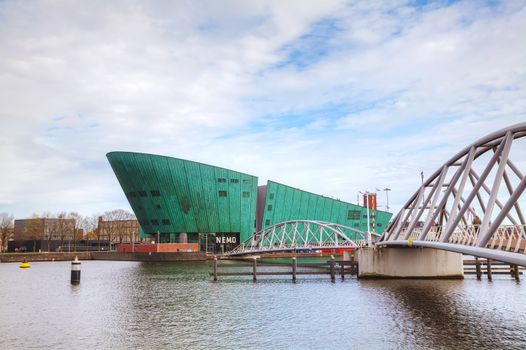 AMSTERDAM - APRIL 16: Science Center Nemo building on April 16, 2015 in Amsterdam, Netherlands. It contains five floors of hands-on science exhibitions and is the largest science center in the Netherlands.