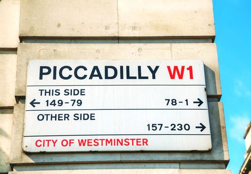 LONDON - APRIL 6: Piccadilly street sign on April 6, 2015 in London, UK. Piccadilly is one of the widest and straightest streets in central London.