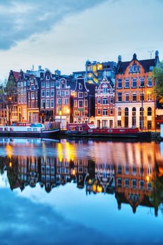 Night city view of Amsterdam, the Netherlands with the Amstel river