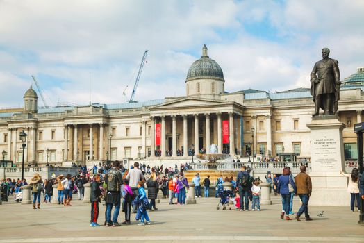 LONDON - APRIL 6: National Gallery building at Trafalgar square on April 6, 2015 in London, UK. Founded in 1824, it houses a collection of over 2,300 paintings dating from the mid-13th century to 1900.
