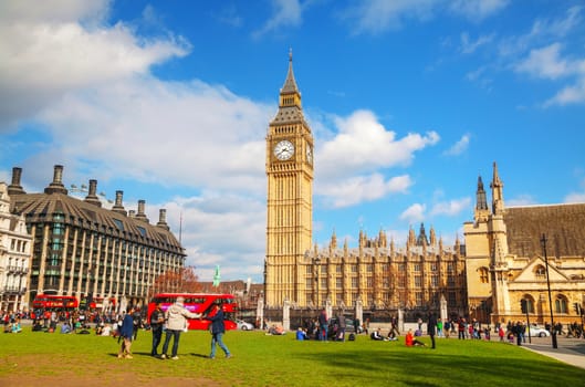 LONDON - APRIL 4: Parliament square with people in city of Westminster on April 4, 2015 in London, UK. It's a square at the northwest end of the Palace of Westminster in London.