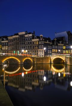 Night city view of Amsterdam, the Netherlands with a canal