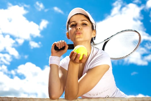 Woman playing tennis in summer