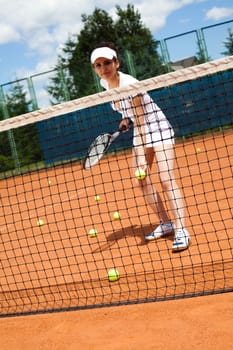 Woman playing tennis in summer