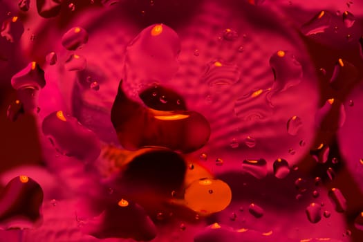 red abstract background with water drops on glass for background or backdrop