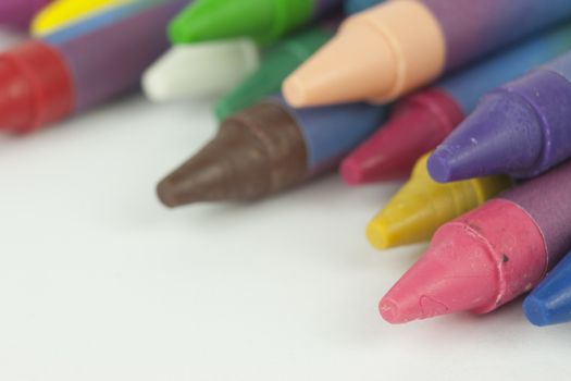 Close up of different coloured crayons
