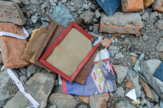 KATHMANDU, NEPAL - MAY 22, 2015: An empty and broken frame lies in the rubble after two major earthquakes hit Nepal on April 25 and May 12, 2015.