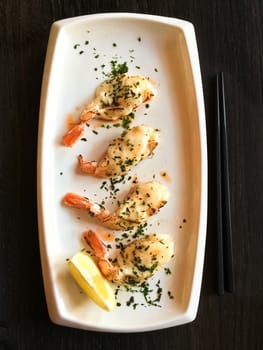 White plate with grilled shrimps. Japanese tapas, traditional cuisine.