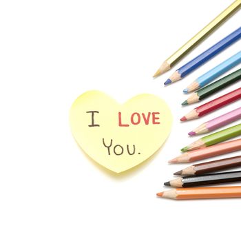 I love you write on heart paper card with color pencil isolated on white background