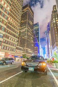 NEW YORK CITY - JUNE 8, 2013: City traffic at night. Traffic is a major issue for the city.