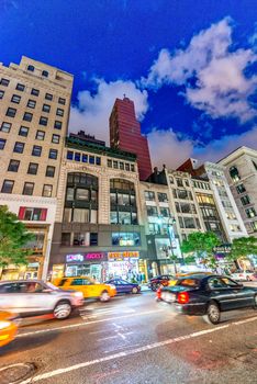 NEW YORK CITY - JUNE 8, 2013: City traffic at night. Traffic is a major issue for the city.