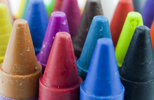 Close up of different coloured crayons