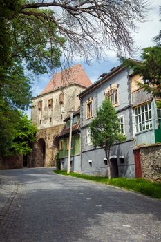 Sighisoara, Romania - June 23, 2013: Furrier's tower (Turnul Cojocarilor) part of  Sighisoara fortress entrance from Transylvania, Romania