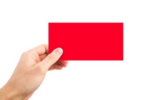 Front view of red blank label holding on hand, isolated on white background.