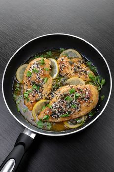 Chicken fillet with sesame seeds in wine-lemon gravy capers and herbs