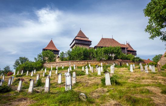Viscri, Romania - June 23, 2013: Fortified Church cemetery at Viscri in Transylvania, Romania