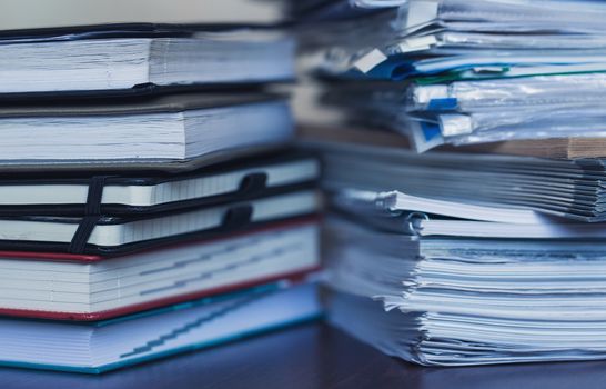 Accounting and taxes. Large pile of magazine and books closeup