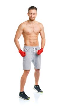 Athletic attractive man wearing boxing bandages on the white background